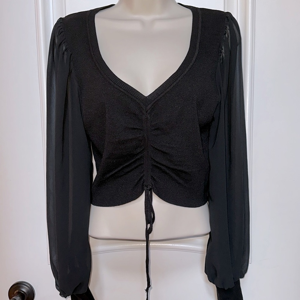 NWT. Black long sleeve sweater blouse